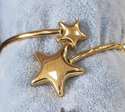 Adjustable rigid bracelet. STARS model. Stainless steel GOLD finish.