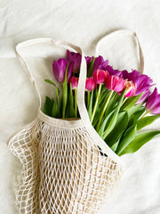 100% cotton mesh bag. Ecological, reusable. It's not heavy. 0 waste bag