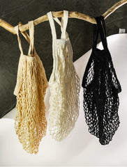 100% cotton mesh bag. Ecological, reusable. It's not heavy. 0 waste bag