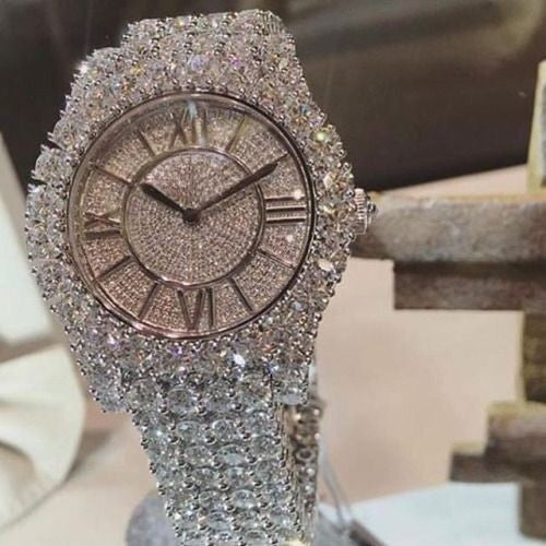 Round women's watch in silver and rhinestones. Cartier style. Novelty