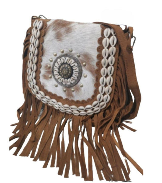 Pony skin bag with fringes and shells.