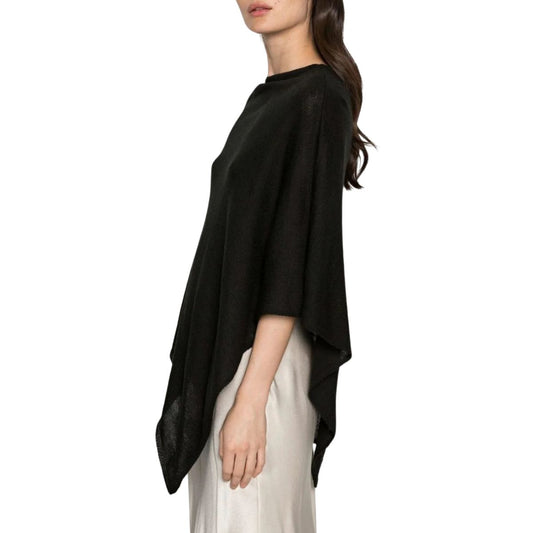 Knitted cape or poncho in shiny BLACK.