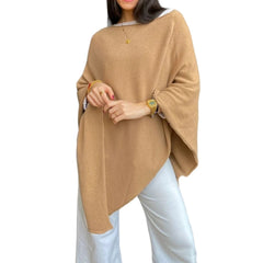 Fine knit cape or poncho. Available in various colors. Novelty