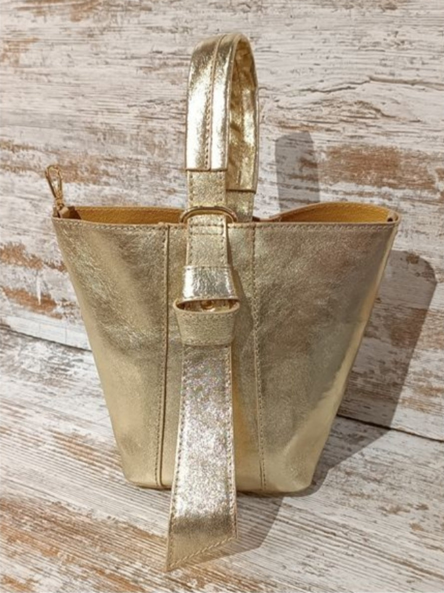 Gold bucket bag. Also in Red. With interior toiletry bag