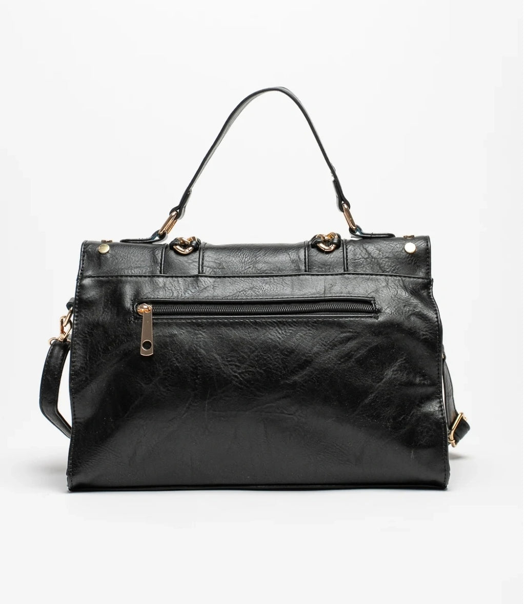 Black bag decorated with gold chains and fringes