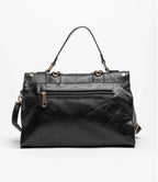 Black bag decorated with gold chains and fringes