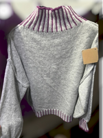 Snuggleable sweater. Available in gray and purple. Novelty