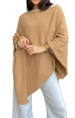 Fine knit cape or poncho. Available in various colors. Novelty