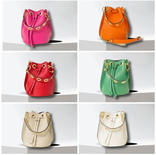 Leather bucket bag in 8 colors. With short handle with gold eyelets + long chain handle with leather. Available in 7 colors.