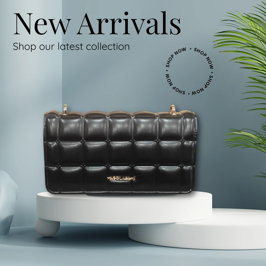 Bolso negro acolchado estilo Chanel. Asas de cadena dorada