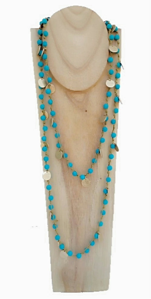 Collar largo de color azul turquesa y abalorios dorados de cuentas de lava  ( modelo 1 )