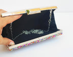 Bolso de fiesta. Clutch multicolor. Piedritas pequeñas con pequeños brillantitos.