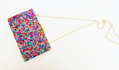 Party bag. Multicolored clutch with medium colored stones