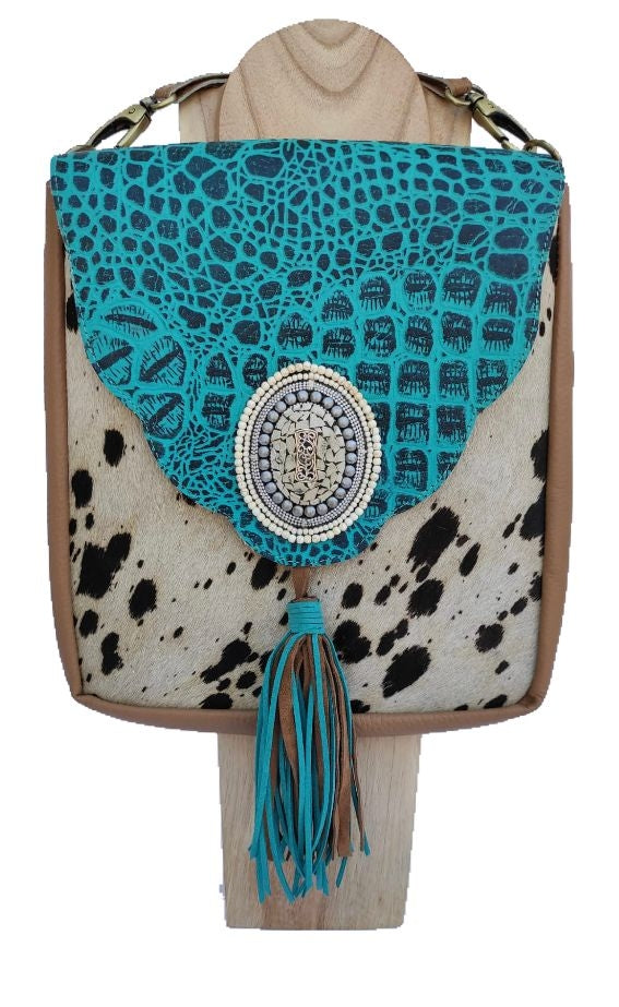 Pony skin shoulder bag with turquoise blue flap